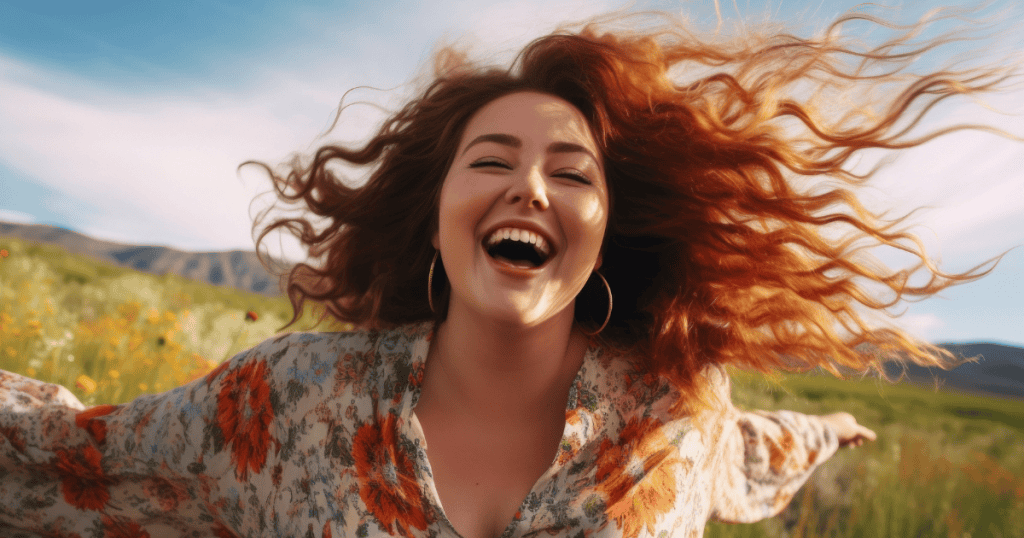 A joyful woman with flowing hair laughs freely in a field of flowers, symbolizing the science-backed strategies that support building a happy life after narcissists.