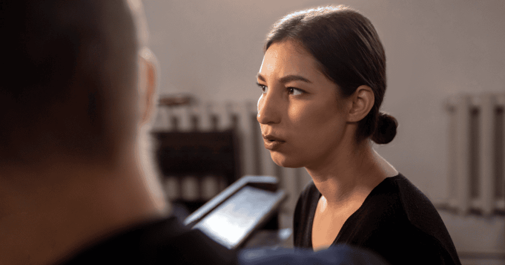 A woman looks at a man with a confused and searching expression, reflecting the common struggle to decipher the true intent behind deceptive behavioral shifts.