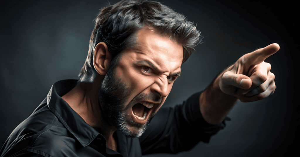 A bearded man points aggressively while shouting into the distance, his forceful demeanor illustrating a total disregard for the emotional boundaries of others.
