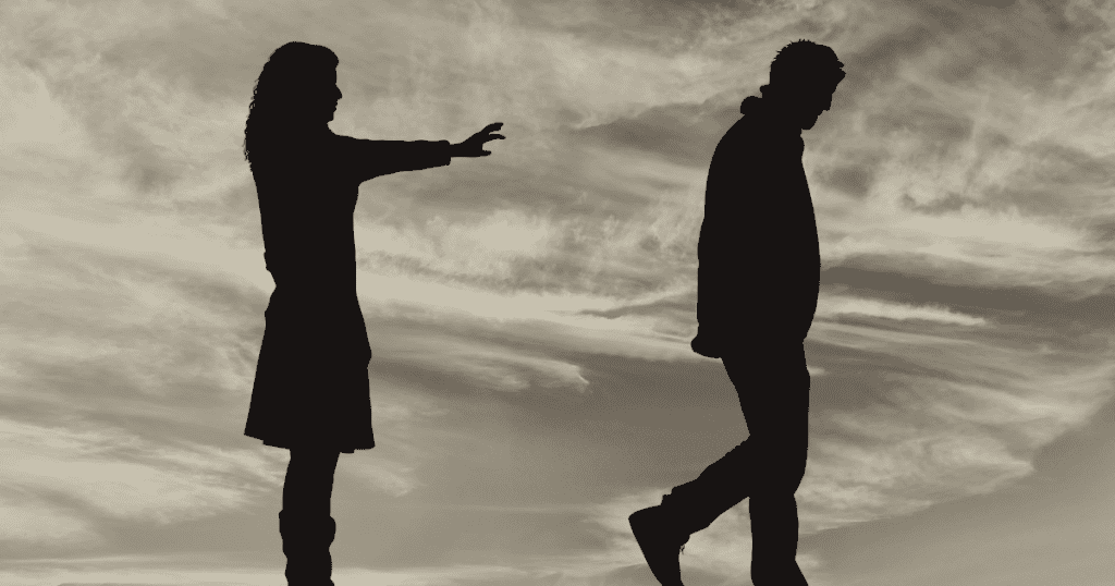 A woman reaches out toward a man walking away into a desolate horizon, illustrating a bond where the emotional pursuit only goes one way.