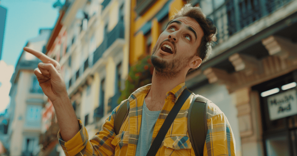 A man points off to the side with a wide-eyed, animated expression as he talks, illustrating how a narcissist tells their distorted version of events with such conviction that they come to believe their own lies.